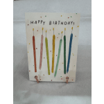 Handmade birthday card with colorful candle drawings and confetti dots