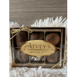 Box of assorted chocolates with a gold ribbon and label