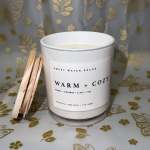 White candle in a glass jar with wooden wicks