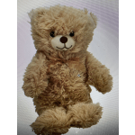 Tan teddy bear with a ribbon bow