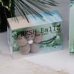 Boxed car air freshener with a flower-shaped felt design