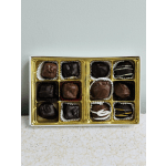 Box of assorted chocolates in gold trays