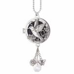Silver hummingbird locket necklace with dangling flower, butterfly, and crystal charms