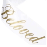 Gold ribbon curls on a white background