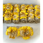Bundles of dried yellow flowers tied with twine