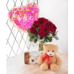 Red rose bouquet with a pink heart balloon and teddy bear