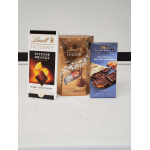 Three boxed chocolates arranged side by side on a white surface