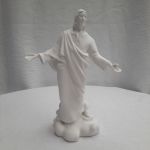 White religious statue of Jesus with outstretched arms