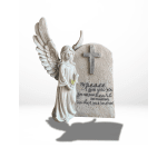 Angel figurine beside a cross memorial plaque with a Bible verse