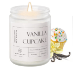 Lit vanilla cupcake scented candle in a glass jar