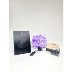 Soap gift set with a purple bath pouf and boxed bar soap