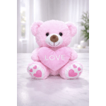 Pink teddy bear holding a heart that says LOVE