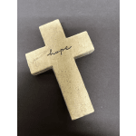 Beige cross-shaped decorative object with the word "hope" on it