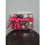 Box of assorted chocolates tied with a red ribbon