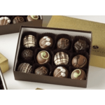 Box of assorted decorated chocolates in paper cups
