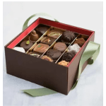 Box of assorted chocolates with green ribbon handles