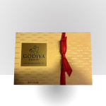 Gold Godiva chocolate gift box tied with a red ribbon