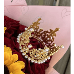 Bouquet of red roses and yellow flowers with a gold jeweled crown topper
