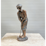 Bronze golfer figurine putting on a stone base