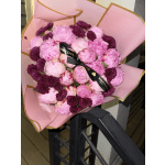 Pink bouquet of peonies and dark purple chrysanthemums wrapped in pink paper