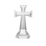 Clear glass cross-shaped memorial keepsake on a stepped base