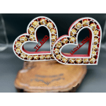 Heart-shaped gift boxes filled with gold-wrapped chocolates