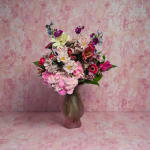 Mixed pink and white bouquet in a frosted vase