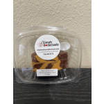 Plastic clamshell container holding dark chocolate peanut butter swirl fudge
