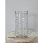 Clear textured glass jar vase on a round marble stand