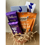 Gift basket with chocolate bars and cookie packages in a small box