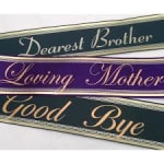 Three memorial ribbons reading Dearest Brother, Loving Mother, and Good Bye