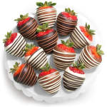 Plate of chocolate-covered strawberries with white and dark drizzle