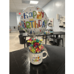 Birthday balloon and candy gift in a mug
