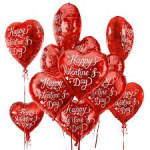 Cluster of red heart-shaped Valentine balloons with white lettering