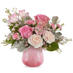 Pink roses and carnations in a pink glass vase