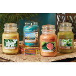 Four Yankee Candle jars with assorted scents on a tray