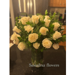 Bouquet of cream roses in a clear glass vase