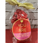 Bag of red foil-wrapped chocolates with a "You Are Loved" tag