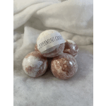 Four peppermint candy bath bombs wrapped in plastic