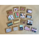 Assorted greeting cards in clear sleeves with floral and butterfly designs