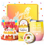 Birthday gift set with candles, a tumbler, and a donut-shaped item