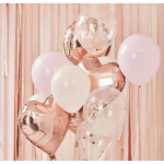 Cluster of pink, white, and rose-gold balloons against a blush backdrop