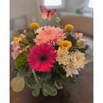 Mixed bouquet with pink and white daisies and a butterfly pick