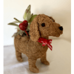 Decorative dog figurine with a red ribbon and heart accent