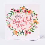 Greeting card with floral wreath and the words "Have a Beautiful Day"