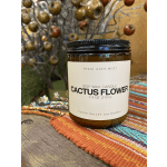 Soy wax candle in an amber glass jar labeled Cactus Flower