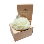 White flower-shaped scented candle in a tan gift box