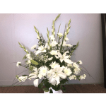 Tall white floral arrangement with lilies and daisy-like blooms in a vase