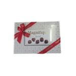 Gift box of chocolates wrapped with a red ribbon