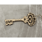 Decorative wooden key ornament with the word LOVE cut out